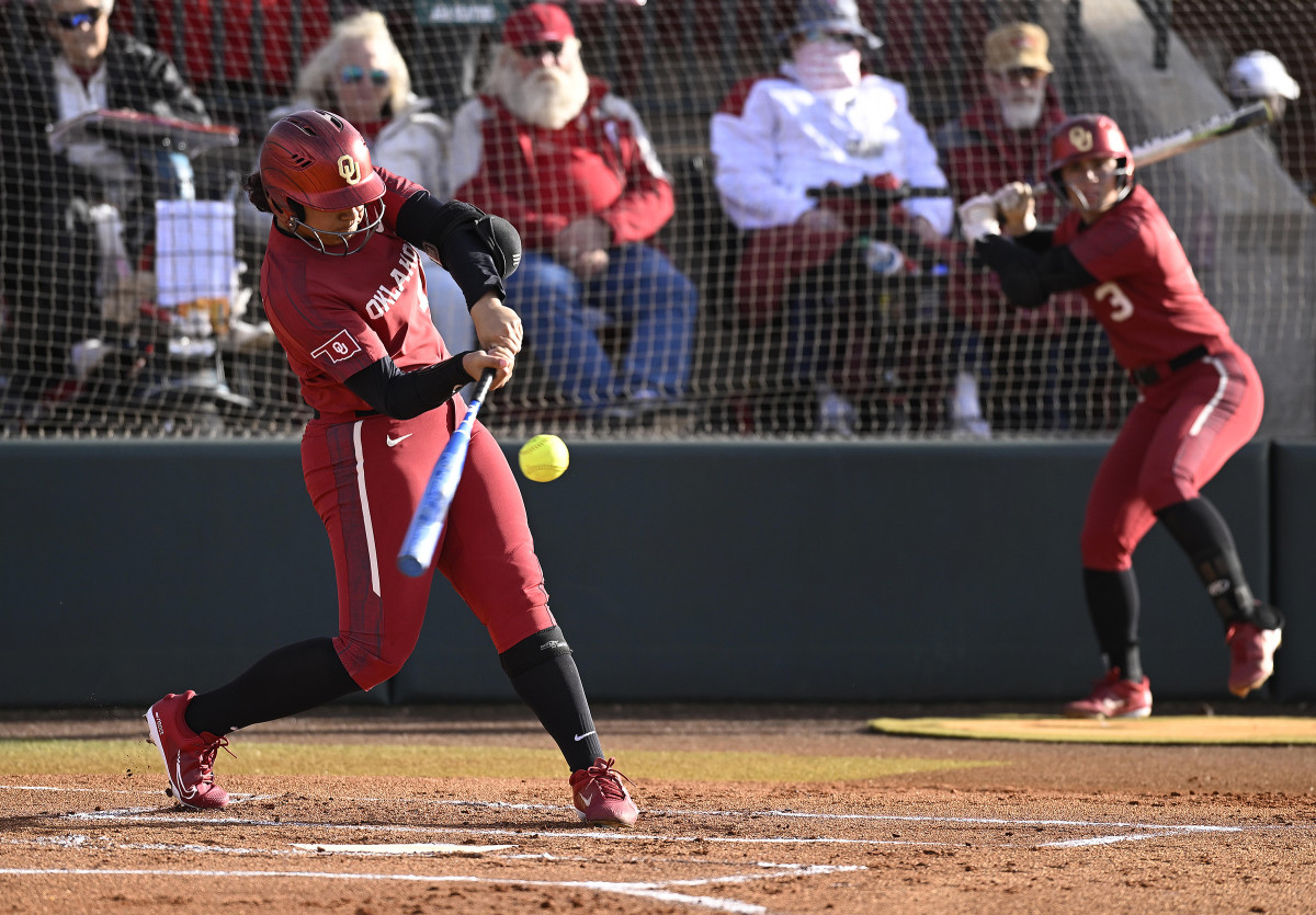 Oklahoma slugger Jocelyn Alo hits the ball during an NCAA softball game.